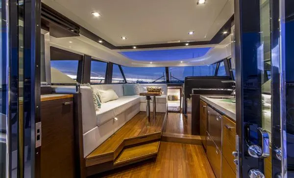 Slide: The Image of Manufacturer Provided Image: Luxurious interior of 2018 Tiara Yachts C44 Coupe with modern design and panoramic windows. - 2