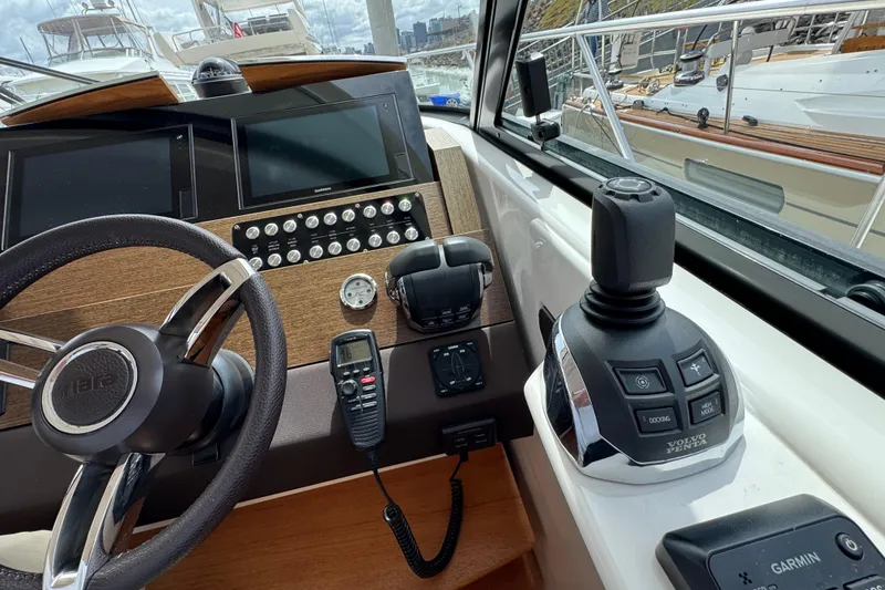 Slide: The Image of Cockpit of 2018 Tiara Yachts C44 Coupe featuring steering wheel and control panel. - 20