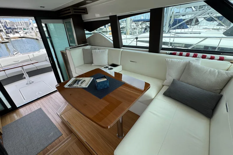 Slide: The Image of Luxurious interior of 2018 Tiara Yachts C44 Coupe with elegant seating and wooden table. - 22