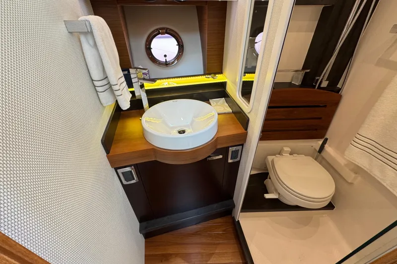 Slide: The Image of Luxurious bathroom in 2018 Tiara Yachts C44 Coupe with modern fixtures and elegant design. - 25