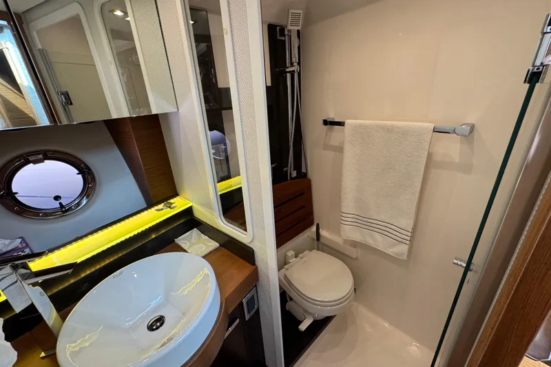 Slide: The Image of Luxurious bathroom in 2018 Tiara Yachts C44 Coupe with modern fixtures and elegant design. - 26