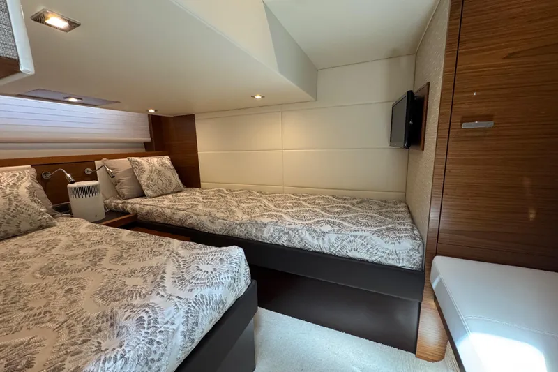 Slide: The Image of Luxurious cabin interior of 2018 Tiara Yachts C44 Coupe with twin beds and modern decor. - 27