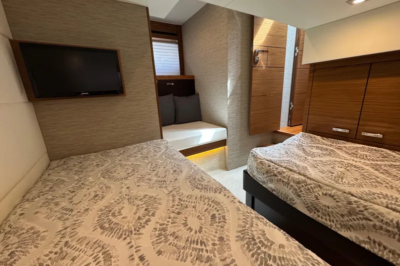 Slide: The Image of Luxurious 2018 Tiara Yachts C44 Coupe cabin with twin beds and modern decor. - 28