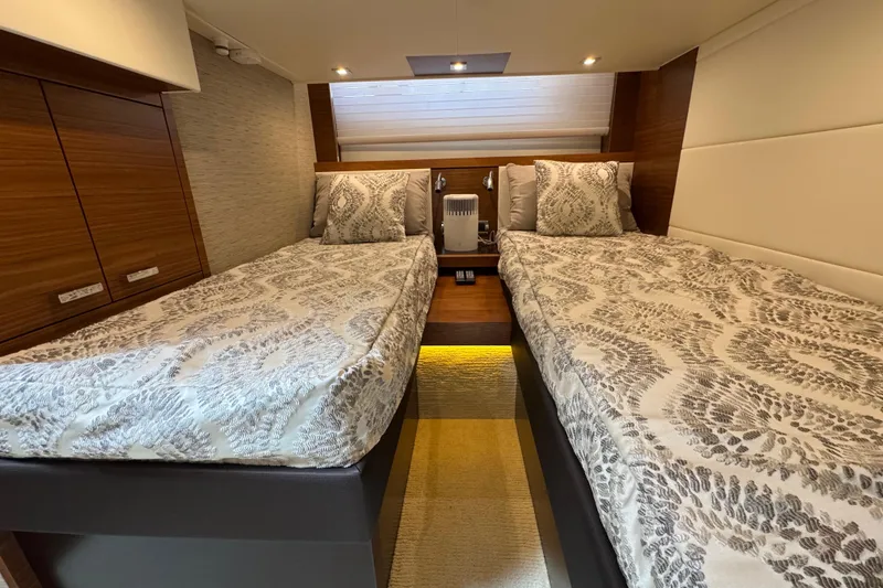 Slide: The Image of Luxurious twin cabin interior of 2018 Tiara Yachts C44 Coupe with elegant bedding. - 29