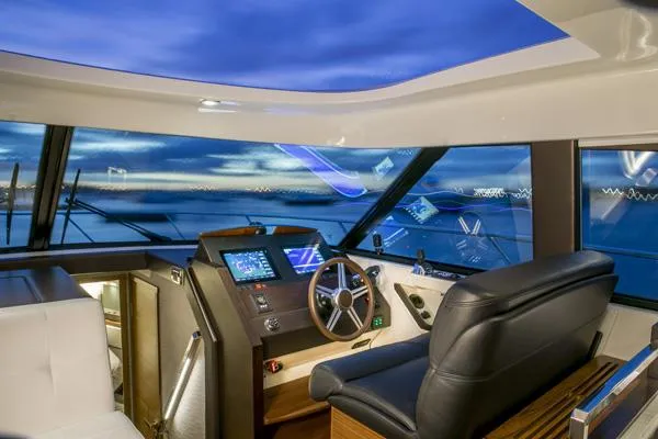 Slide: The Image of Manufacturer Provided Image: Interior helm of 2018 Tiara Yachts C44 Coupe with modern navigation equipment. - 3