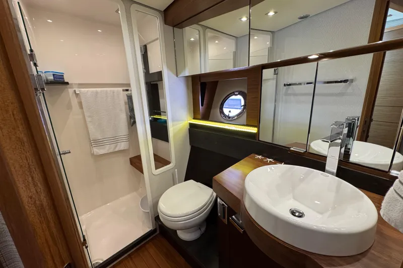 Slide: The Image of Luxurious bathroom in 2018 Tiara Yachts C44 Coupe, featuring modern fixtures and elegant design. - 30