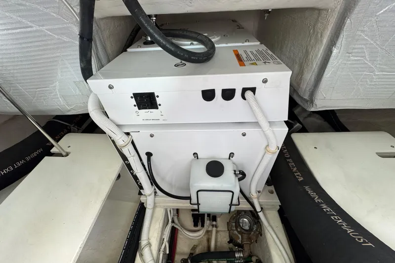 Slide: The Image of Engine compartment of a 2018 Tiara Yachts C44 Coupe, showcasing mechanical components. - 35