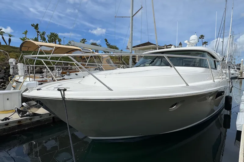 Slide: The Image of 2018 Tiara Yachts C44 Coupe docked at marina, showcasing sleek design and luxury features. - 8