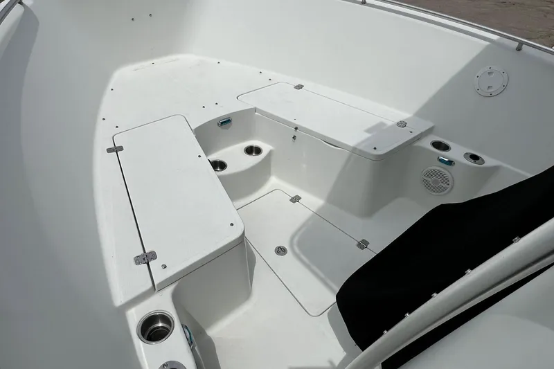 Slide: The Image of 2008 Sailfish 2360 CC boat interior with seating and storage compartments. - 15