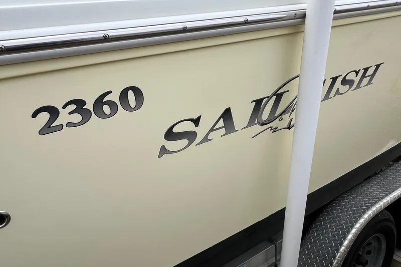 Slide: The Image of 2008 Sailfish 2360 CC boat side view with model name and number. - 4