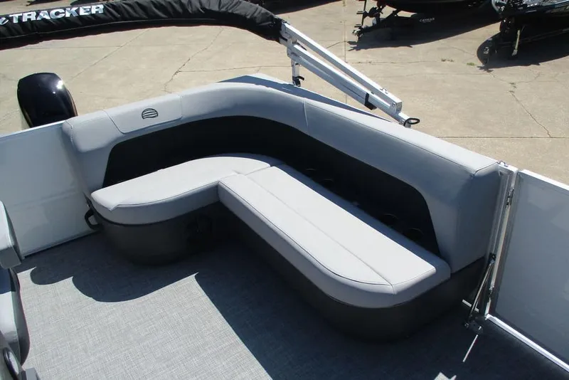 Slide: The Image of 2026 Sun Tracker Party Barge 16 DLX interior with gray seating and spacious layout. - 10