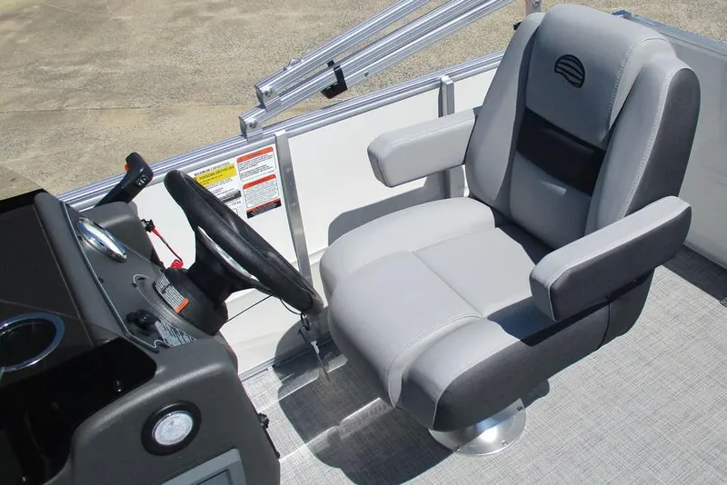 Slide: The Image of Captain's chair and steering console of 2026 Sun Tracker Party Barge 16 DLX pontoon boat. - 4