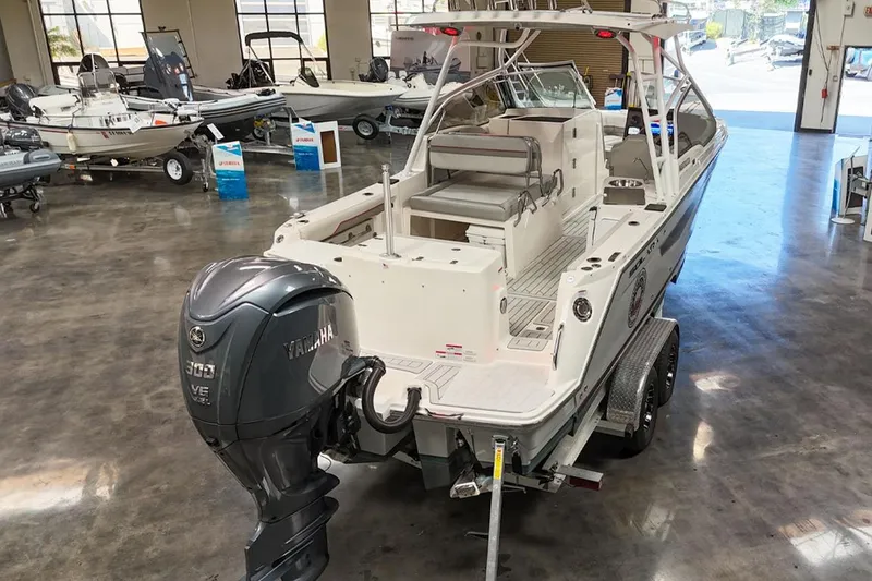 Slide: The Image of 2024 Solara S250 Dual Console boat with Yamaha engine in showroom. - 5