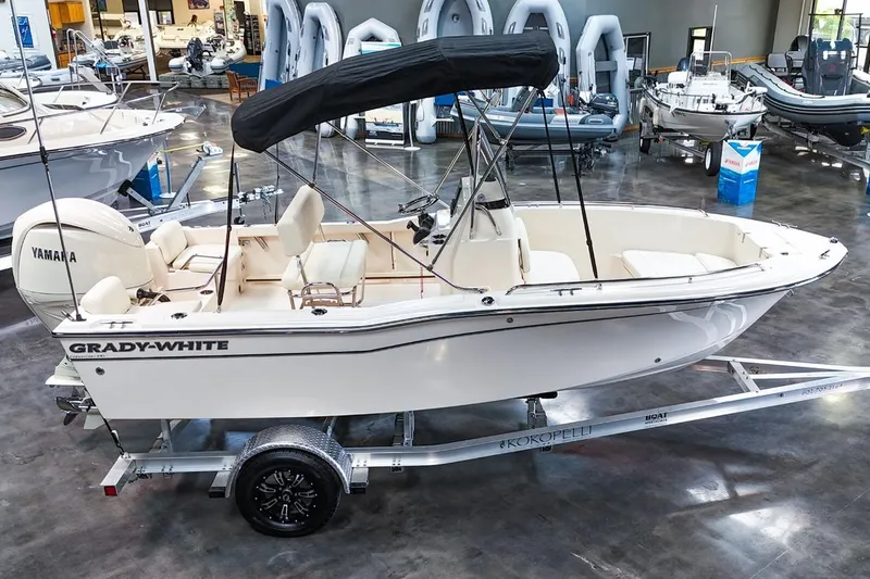 Slide: The Image of 2025 Grady-White Fisherman 180 boat with Yamaha engine on trailer in showroom. - 5