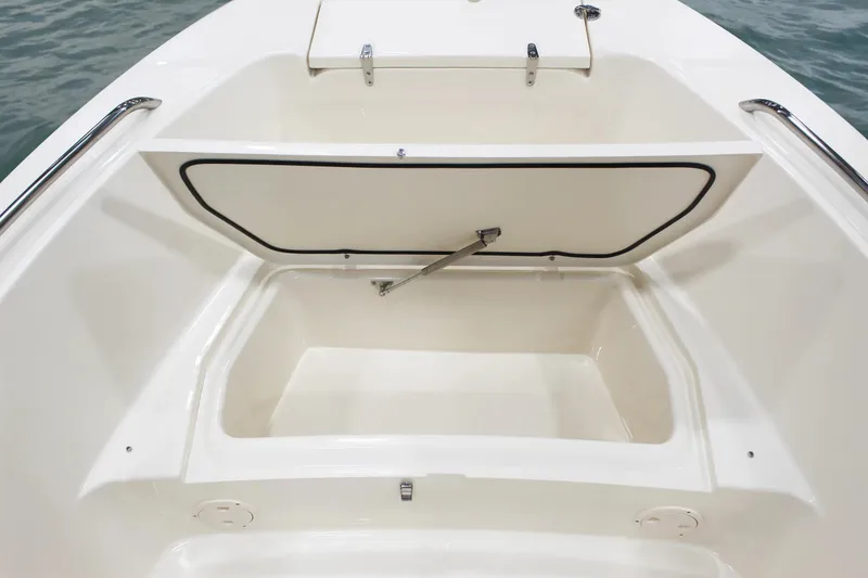 Slide: The Image of 2025 Grady-White Fisherman 180 boat storage compartment open, showcasing spacious interior design. - 8