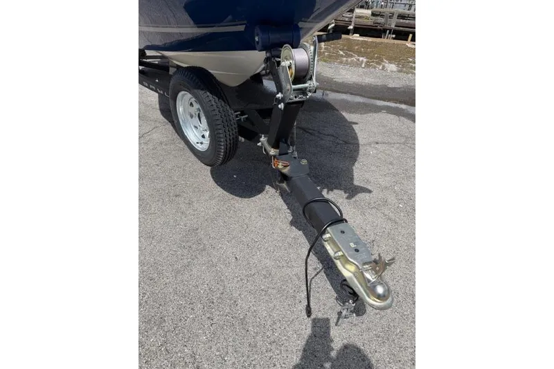 Slide: The Image of Trailer hitch of a 2017 Bayliner 160 Bowrider on pavement. - 14