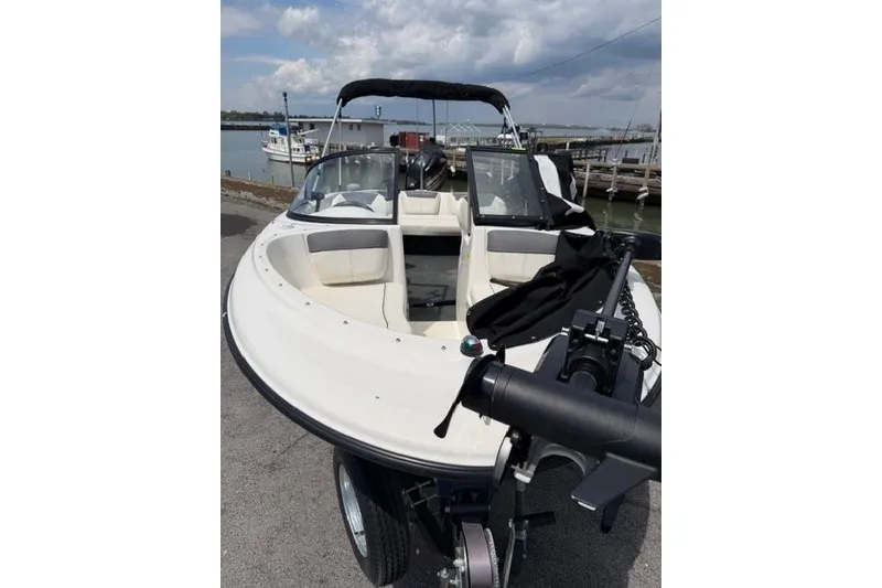 Slide: The Image of 2017 Bayliner 160 Bowrider boat docked, featuring spacious seating and sleek design. - 3