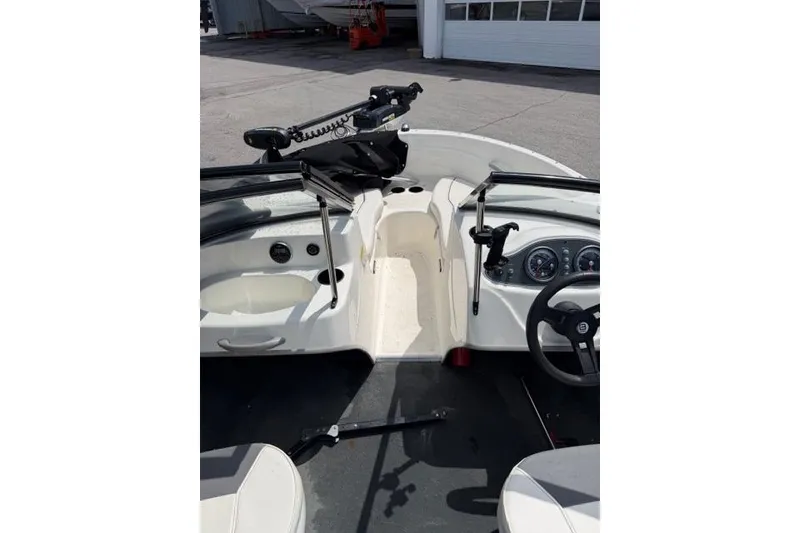 Slide: The Image of 2017 Bayliner 160 Bowrider interior with steering wheel and dashboard controls. - 7
