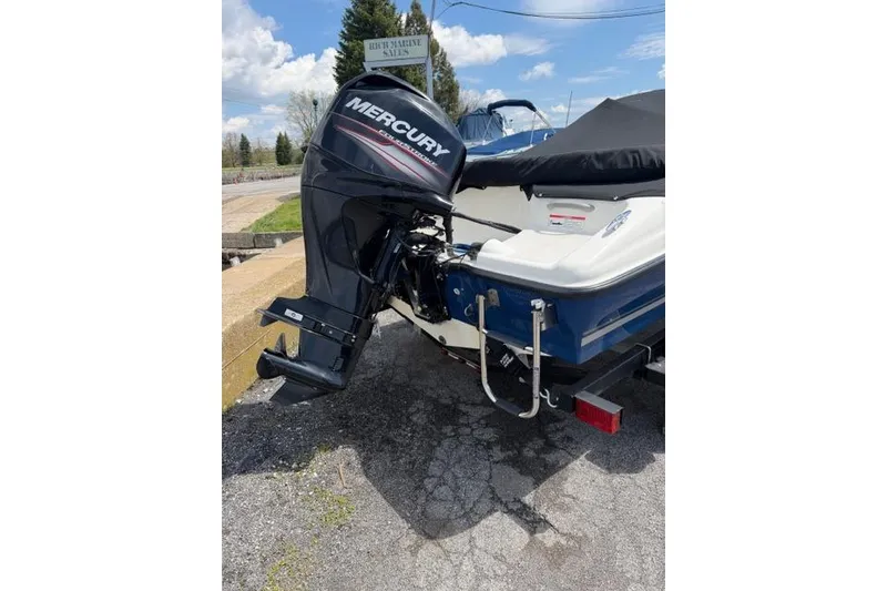 Slide: The Image of 2017 Bayliner 160 Bowrider with Mercury outboard motor, parked outdoors. - 9