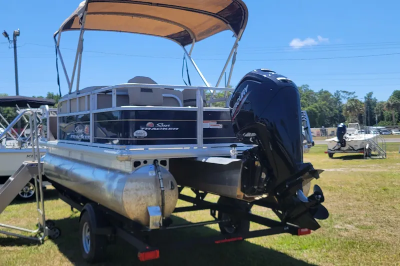 Slide: The Image of 2023 Sun Tracker Bass Buggy 18 DLX pontoon boat with canopy and outboard motor. - 4