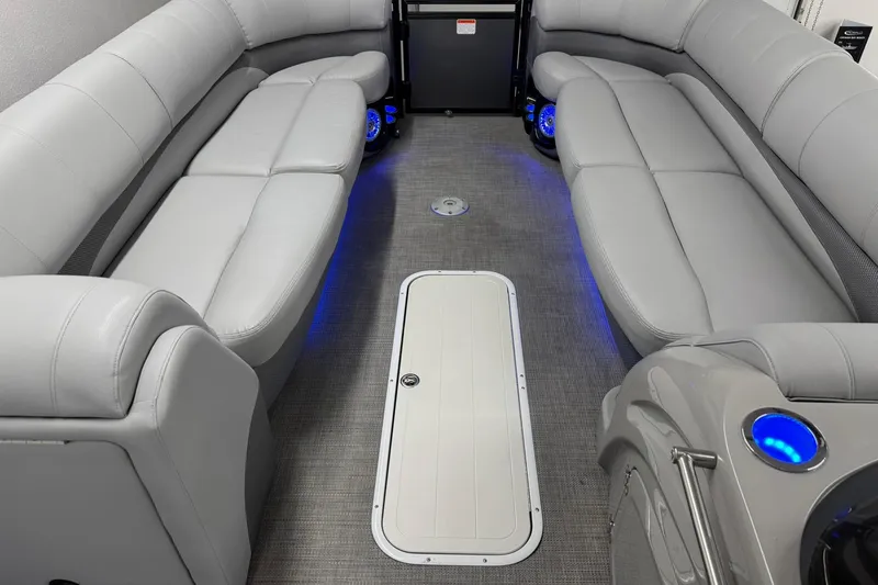 Slide: The Image of Luxurious interior of a 2017 Regency 254 LE3 pontoon boat with plush seating and ambient lighting. - 10