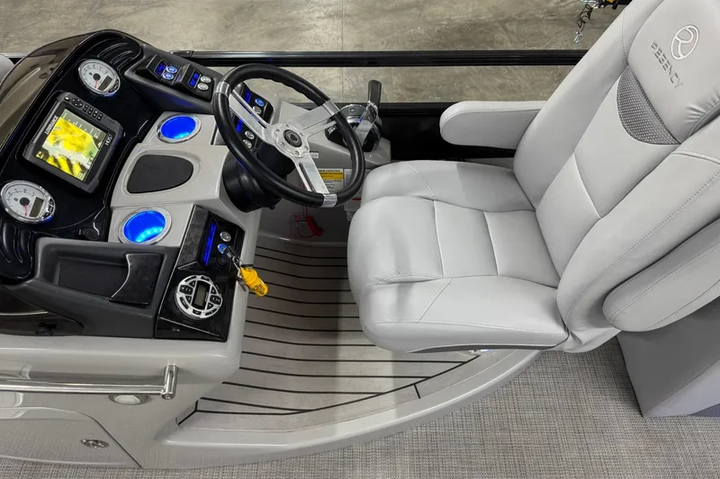 Slide: The Image of Luxurious 2017 Regency 254 LE3 boat helm with plush captain's chair and modern controls. - 12