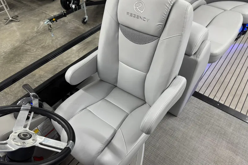 Slide: The Image of Luxurious 2017 Regency 254 LE3 boat seat with steering wheel, showcasing premium design. - 15