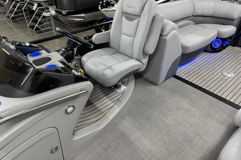 Slide: The Image of Luxurious interior of 2017 Regency 254 LE3 pontoon boat with plush seating and modern dashboard. - 16