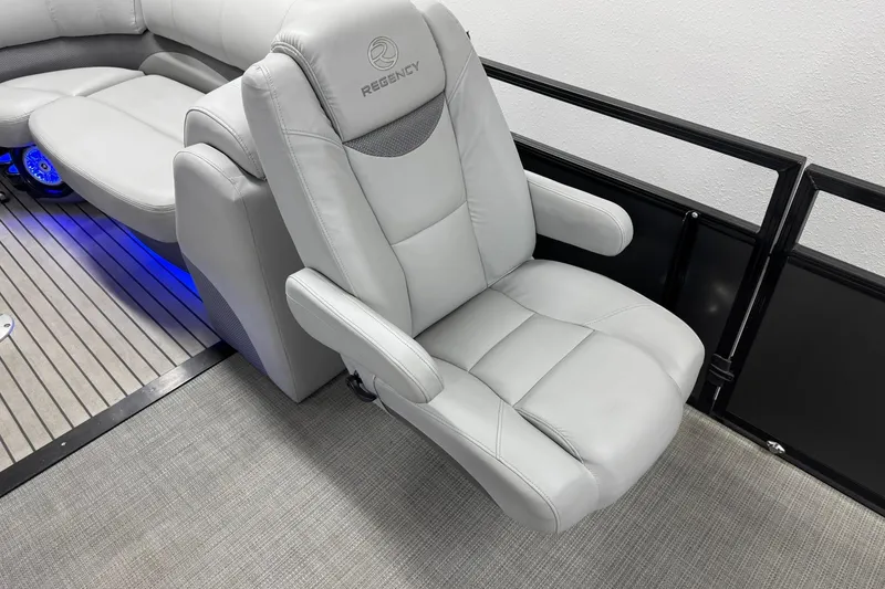 Slide: The Image of Luxurious seating on 2017 Regency 254 LE3 boat with ambient blue lighting. - 17