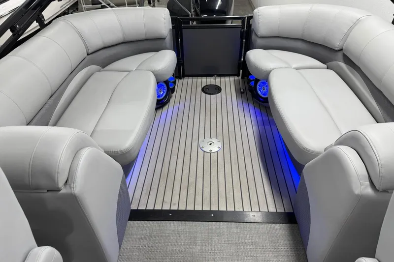 Slide: The Image of Luxurious interior of 2017 Regency 254 LE3 pontoon boat with plush seating and ambient lighting. - 18