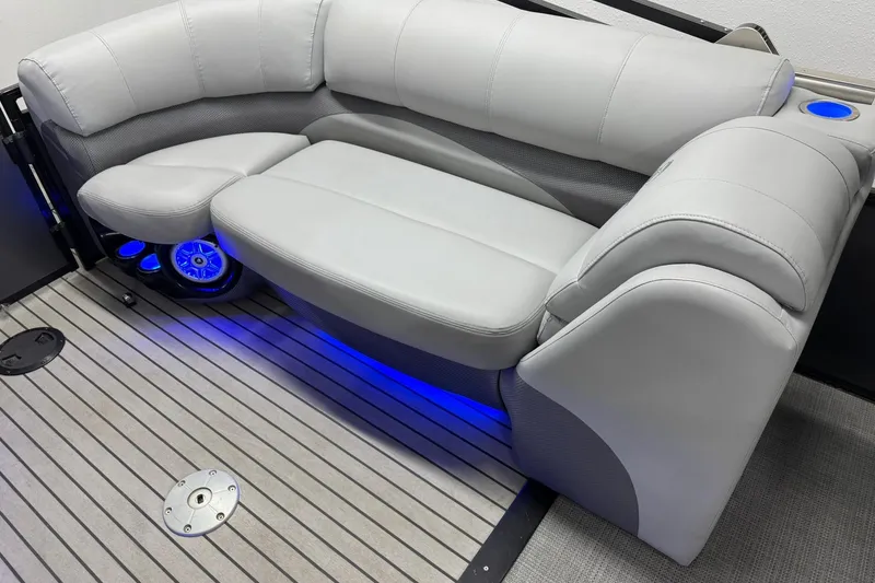 Slide: The Image of Luxurious seating on 2017 Regency 254 LE3 boat with blue LED lighting and cup holders. - 19