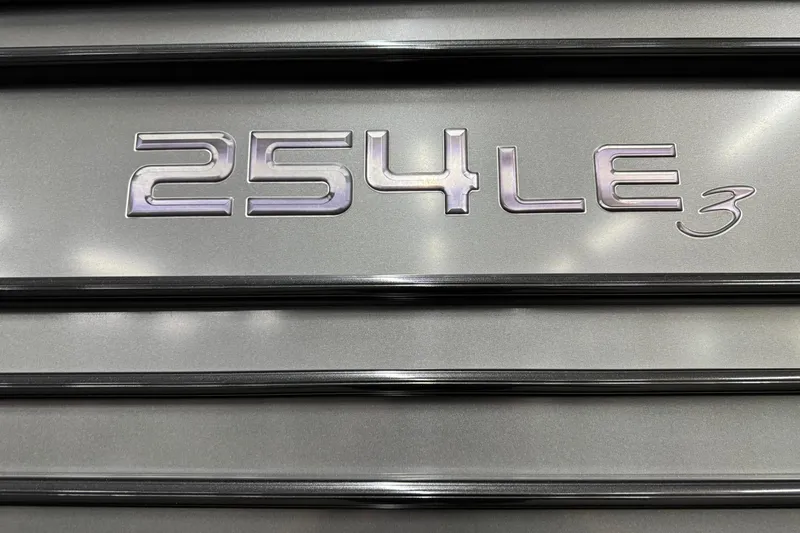 Slide: The Image of Regency 254 LE3 2017 model emblem on metallic surface. - 23