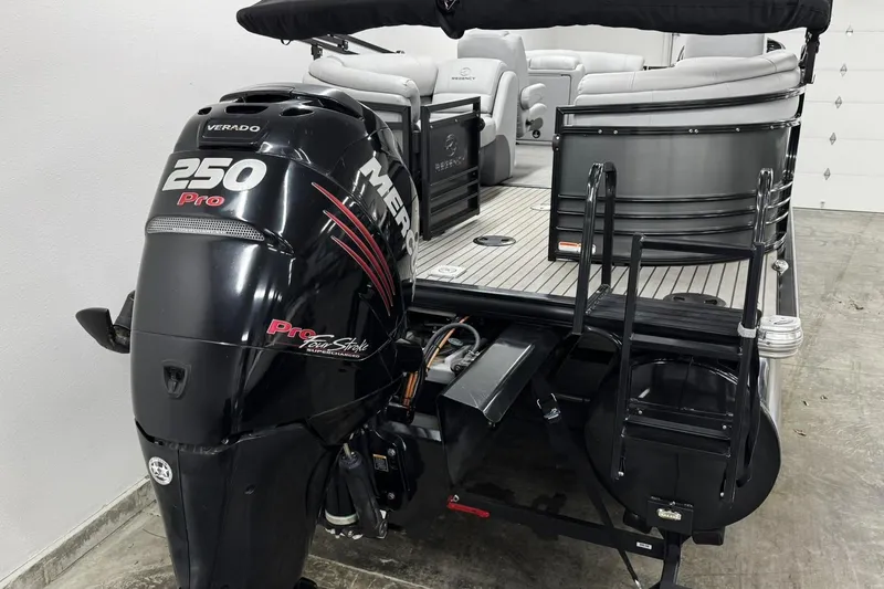 Slide: The Image of 2017 Regency 254 LE3 boat with Mercury 250 Pro outboard motor in a garage. - 5