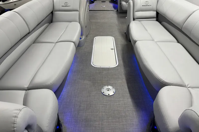 Slide: The Image of Luxurious interior of 2017 Regency 254 LE3 pontoon boat with plush seating and ambient lighting. - 7