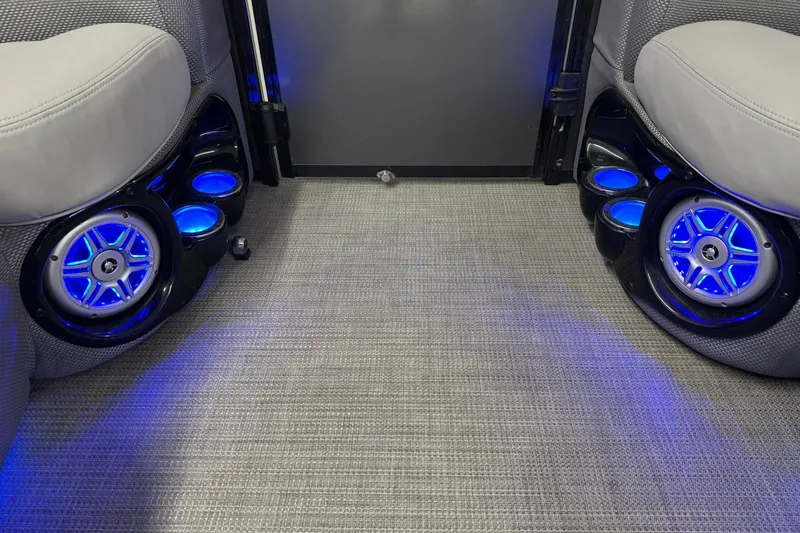 Slide: The Image of Interior of 2017 Regency 254 LE3 with illuminated speakers and cup holders. - 9