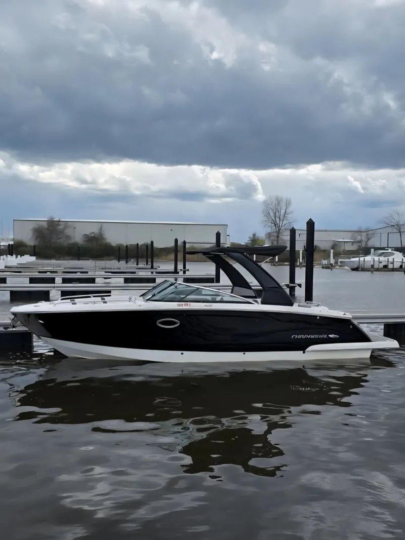 The Image of 2019 Chaparral 277 SSX boat docked under cloudy skies. - 0