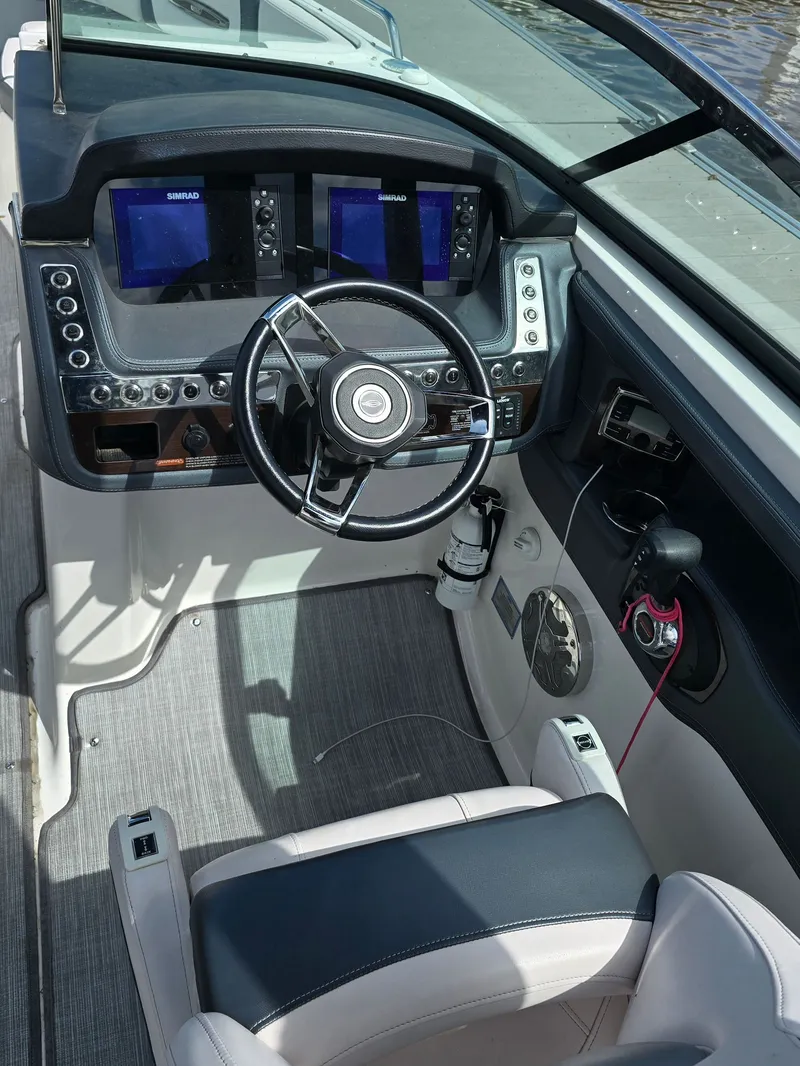 Slide: The Image of Interior view of a 2019 Chaparral 277 SSX boat cockpit. - 2