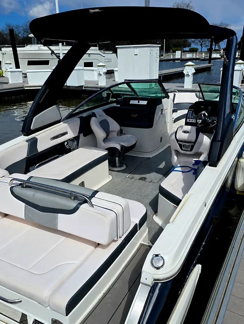 Slide: The Image of Interior view of a 2019 Chaparral 277 SSX boat at the dock. - 3