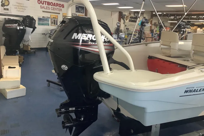 The Image of 2019 Boston Whaler 160 Super Sport with Mercury outboard in showroom setting. - 1