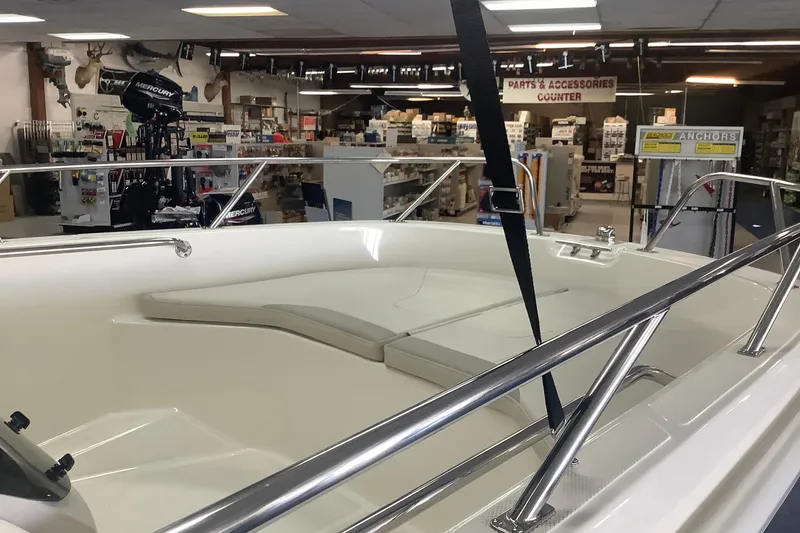 Slide: The Image of 2019 Boston Whaler 160 Super Sport boat interior in showroom with accessories. - 4