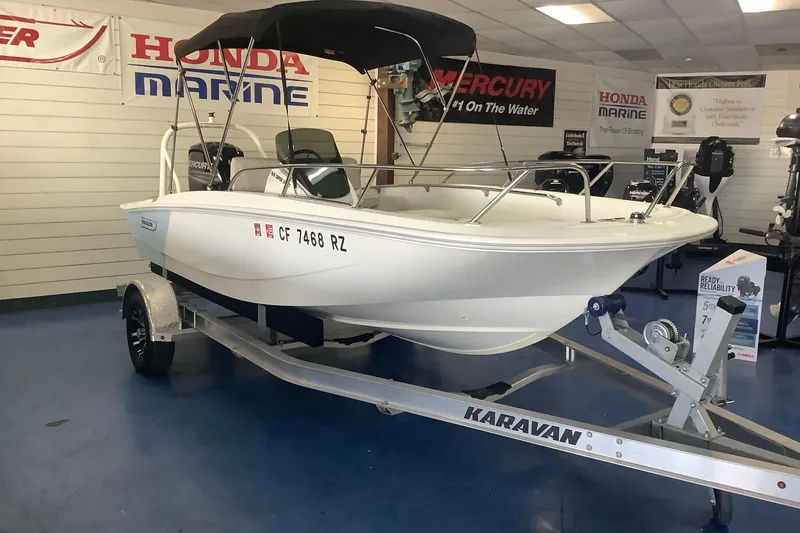 Slide: The Image of 2019 Boston Whaler 160 Super Sport boat on Karavan trailer in showroom. - 5