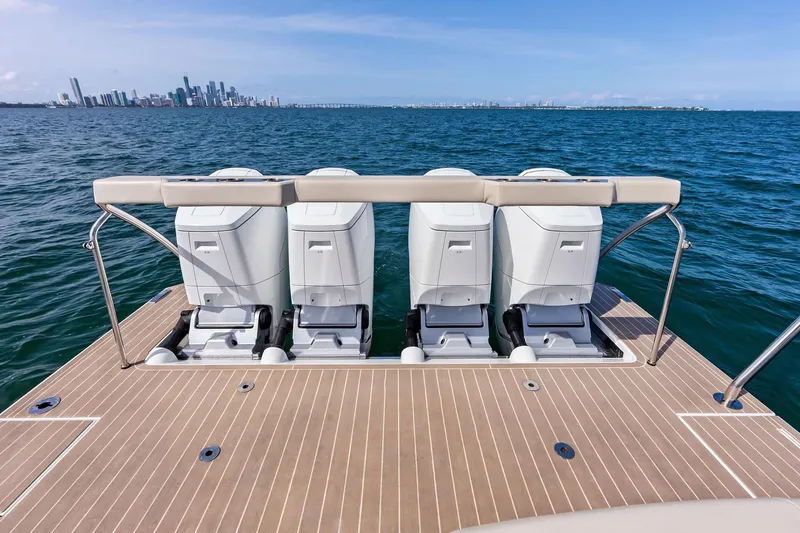 Slide: The Image of 2025 Formula 500 Super Sport Crossover boat with four engines, ocean view, city skyline background. - 11