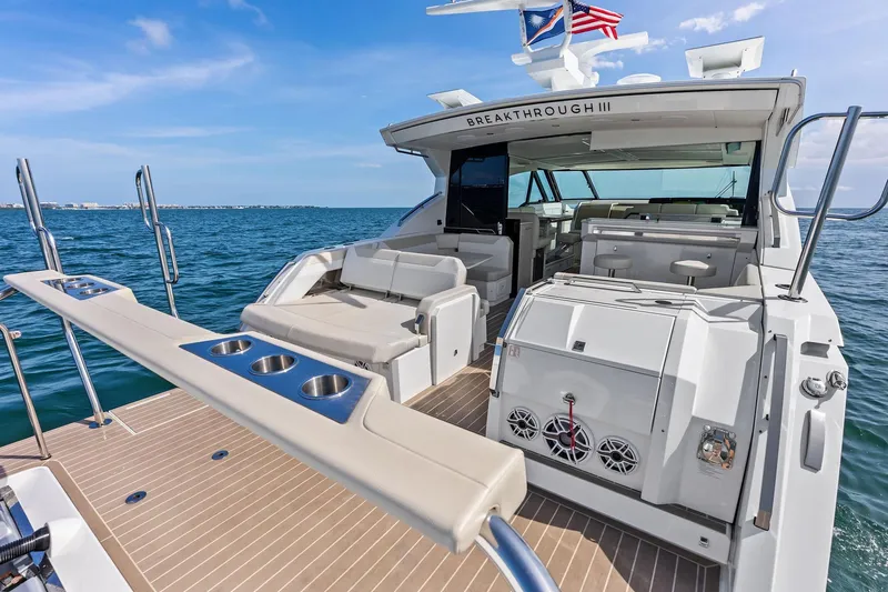 Slide: The Image of 2025 Formula 500 Super Sport Crossover yacht with luxurious deck and seating on open water. - 13