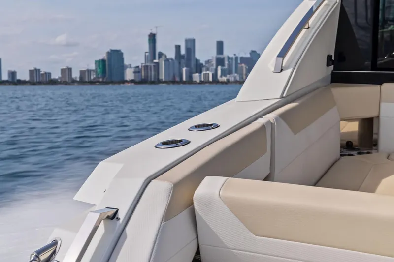 Slide: The Image of Luxury seating on 2025 Formula 500 Super Sport Crossover yacht with city skyline view. - 15