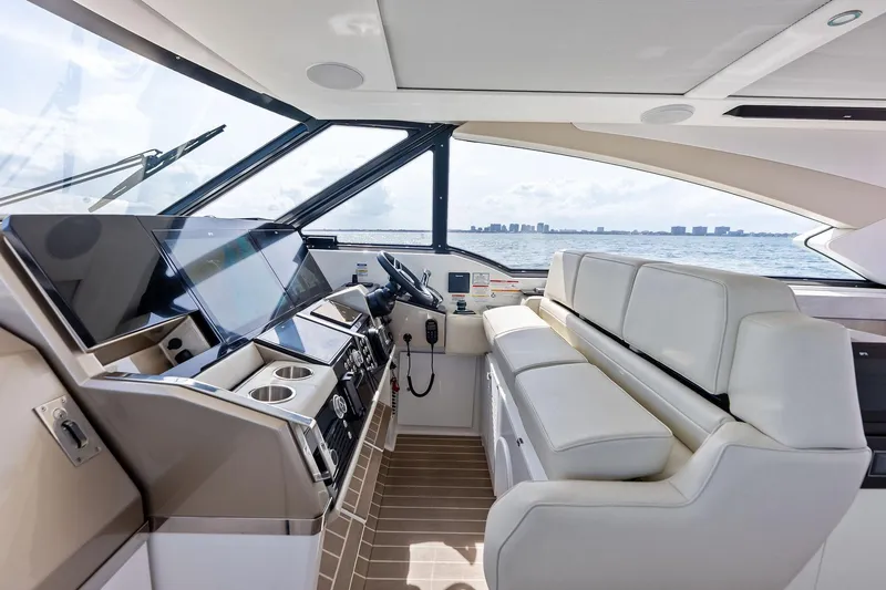 Slide: The Image of Luxurious interior of 2025 Formula 500 Super Sport Crossover yacht with modern helm and seating. - 17