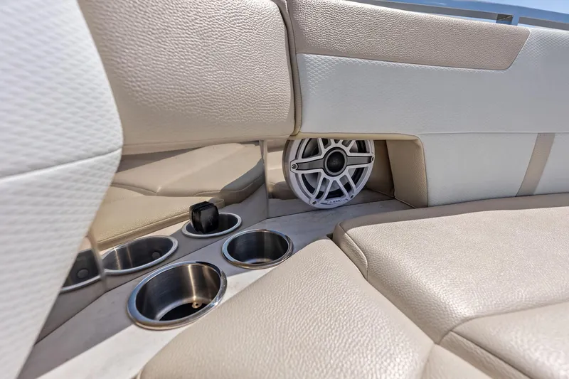 Slide: The Image of 2025 Formula 500 Super Sport Crossover interior with cup holders and speaker. - 19