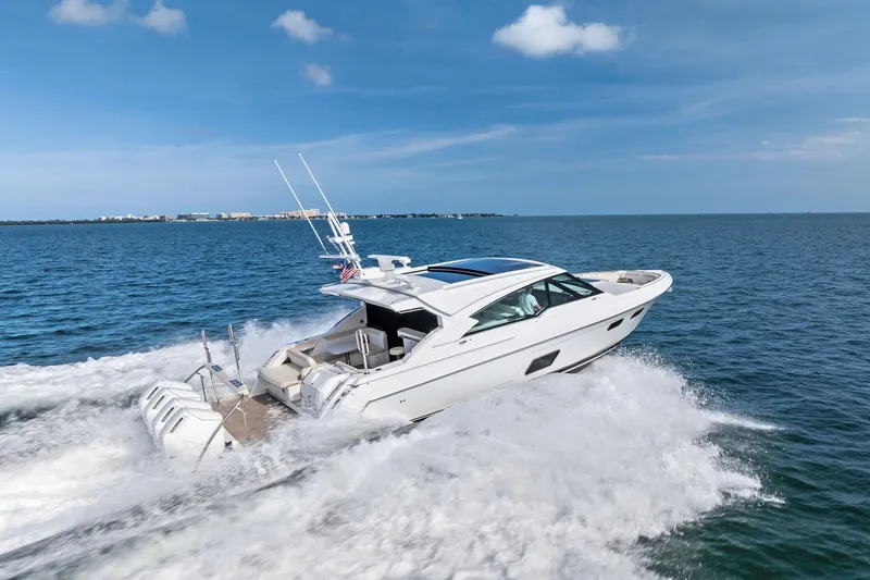 Slide: The Image of 2025 Formula 500 Super Sport Crossover yacht cruising on open water. - 2