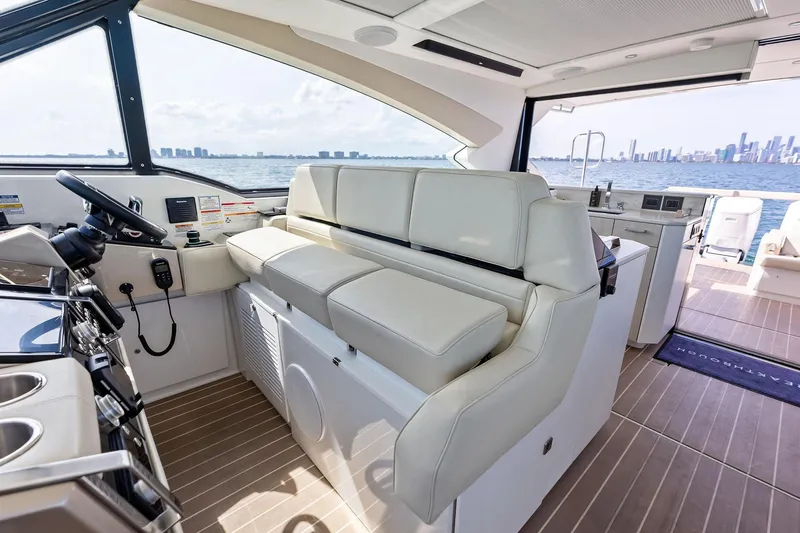 Slide: The Image of Luxurious interior of 2025 Formula 500 Super Sport Crossover yacht with city skyline view. - 20