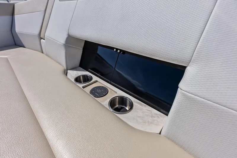 Slide: The Image of 2025 Formula 500 Super Sport Crossover interior with cup holders and speaker. - 22