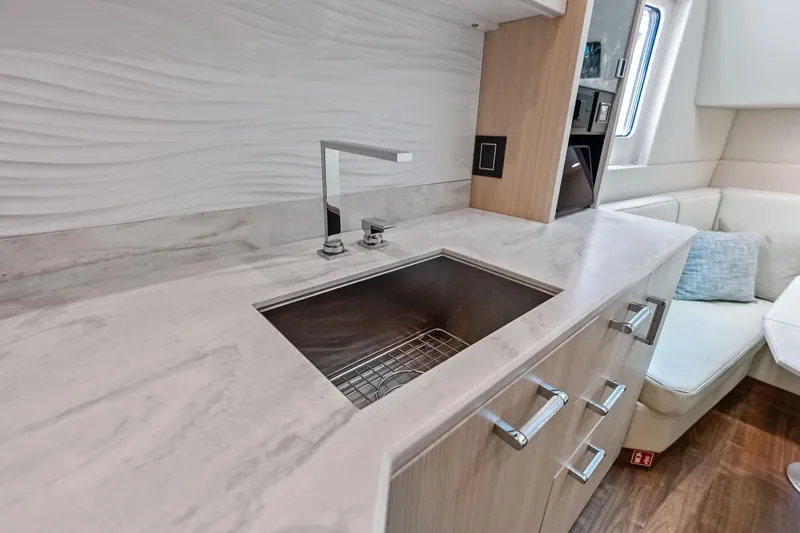 Slide: The Image of Modern kitchen interior of 2025 Formula 500 Super Sport Crossover yacht, featuring sleek design and amenities. - 24